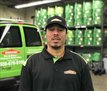 Crew Chief Raul Santos poses in front of our work van and air movers